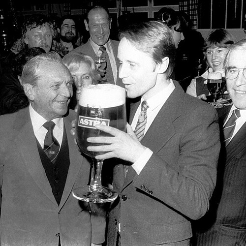 Toasting with an oversized Astra beer glass in 1980.