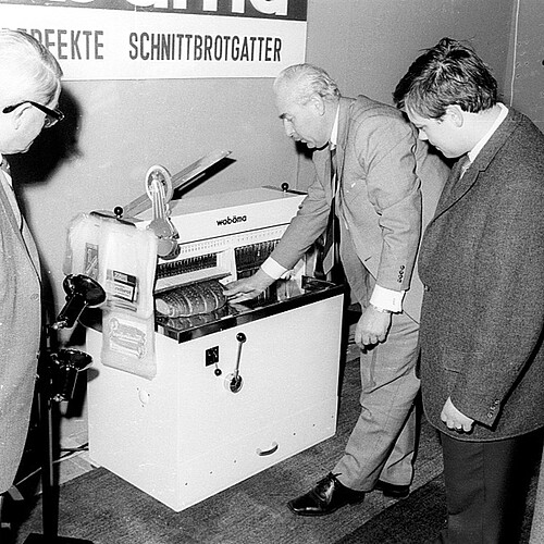 Demonstration of a bread-slicing machine in 1968